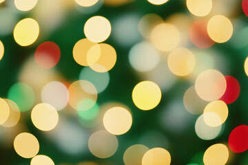 Fototapeta premium Colorful bokeh lights in shades of red, yellow, green, and white, creating a festive and vibrant abstract background ideal for holiday designs and celebratory decorations.