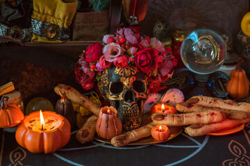 Illustration for celebrating Halloween party, spooky details and magical stuff, candles and pumpkinsб сcookies on a table