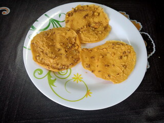 Crispy Peanut Snack or Rempeyek or peyek is a deep-fried savoury Indonesian-Javanese cracker close up. photo taken in malaysia
