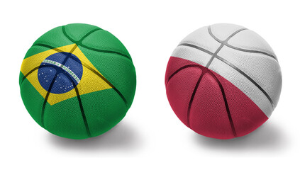Obraz premium basketball balls with the national flags of poland and brazil on the white background.