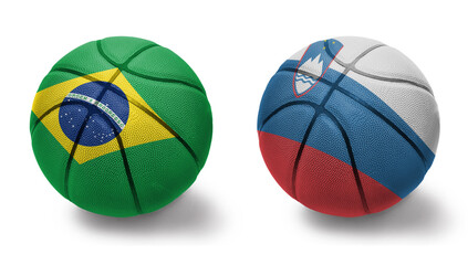 basketball balls with the national flags of slovenia and brazil on the white background.