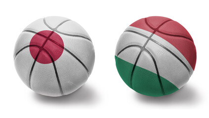 basketball balls with the national flags of hungary and japan on the white background.