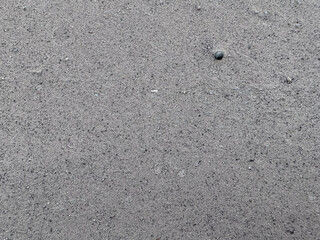 Gray ash like sand from burning coal for background.