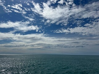 Obraz premium Sky, clouds, sea calm shiny waters