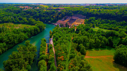 Trezzo sul Adda, Italy. Aerial view of a mountain freshwater river with low water level surrounded...