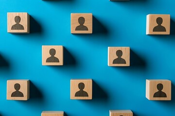 Blue Background with Wooden Blocks & Person Icons  Flat Lay Arrangement