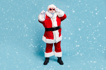 Full length body size view of his he nice funky bearded Santa Claus wearing phonendoscope making diagnostic isolated over blue turquoise pastel color background