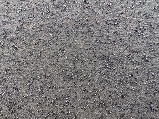 Defocused gray ash like sand from burning coal for background.