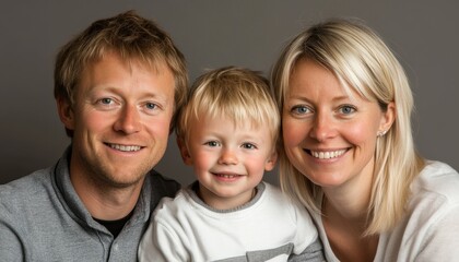 Family portrait of father, mother, and son smiling together indoors at home