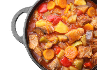 Delicious stew with vegetables in pot isolated on white, top view