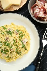 Delicious pasta Carbonara served on table, flat lay
