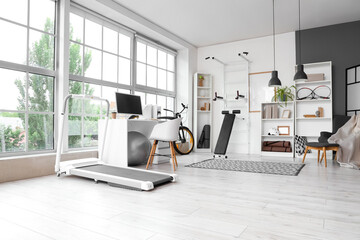 Interior of gym with modern sports equipment