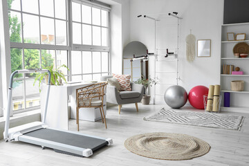 Interior of gym with modern sports equipment
