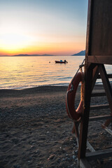 Dawn on a beach on the Peloponnese peninsula at a campsite for campers. Summer vacation in Greece.