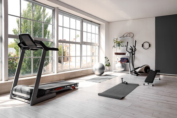 Interior of gym with modern sports equipment