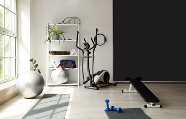 Interior of gym with modern sports equipment