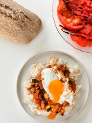 fried egg menu with white rice and eggplant with tomato salad