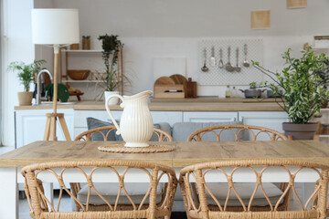 Jug on table in light kitchen