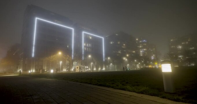 city at night during a foggy winter