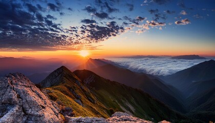 Obraz premium stunning sunset view from a mountain peak showcasing clouds and distant landscapes