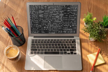 Mathematic equations and modish formula on computer screen showing concept of science and education