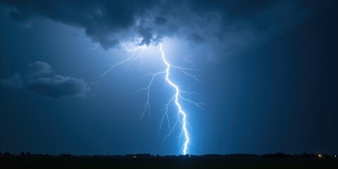 Dramatic lightning strikes illuminate a stormy sky, capturing nature's raw power. Ideal for weather-related themes or dramatic imagery in various projects.