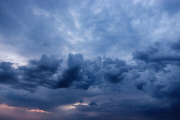 Obraz premium Dramatic Storm Clouds in Sunset. Climate Change and Global Warming 