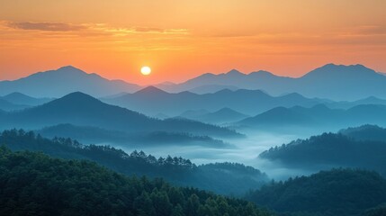 Obraz premium Serene sunrise over misty mountains, showcasing nature's beauty and tranquility.