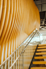 Wooden staircase with modern design in open space office 