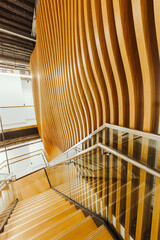 Wooden staircase with modern design in open space office 