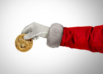 Christmas Holiday Snack and winter season food celebration as Santa and santaclaus holding a chocolate chip cookie as a seasonal new year festive spirit celebration with a sweet treat.