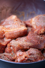Pieces of pork prepared for curing.