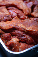 Pieces of pork prepared for curing.