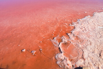 Colorful textures of the pink lagoon in the saltworks of Santa Pola town, Spain