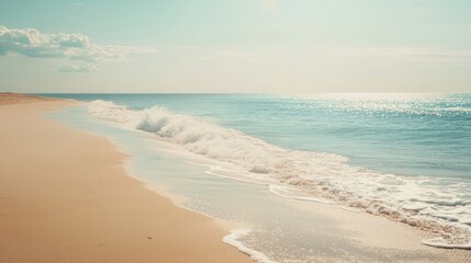 Obraz premium Serene beach with gentle waves and endless horizon, perfect for relaxation and escape. Sunny day enhances tranquility and coastal beauty.