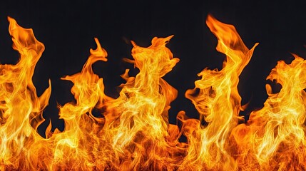 Isolated fire flames against a black backdrop, creating a dramatic effect with copy space for text or promotional materials.