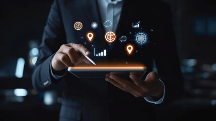 Businessman using digital tablet with futuristic holographic icons