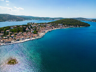 Fototapeta premium Amazing aerial view of Rogoznica archipelago, Croatia, with anchored sailing boats and yachts in marina and amazing landscape of islands and peninsulas