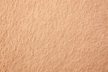 Soft peach wall texture with a velvety finish, gentle, soothing, environment, low angle