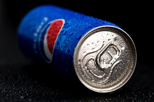 Editorial photo of Pepsi can with water droplets on black background. Studio shot in Bucharest, Romania, 2021