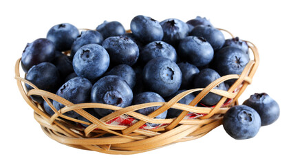 Wicker basket overflowing with freshly picked blueberries on a transparent background
