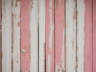 weathered pink and white wooden planks background.