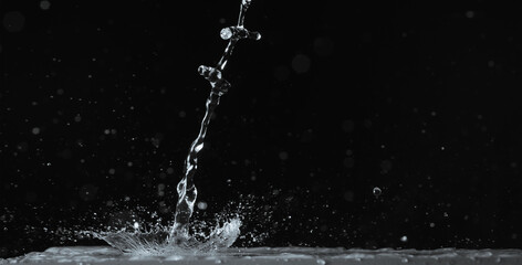 Fototapeta premium Image of water splashing in the dark