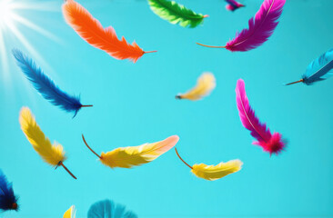 Many flying fluffy multi-colored feathers on a light blue background