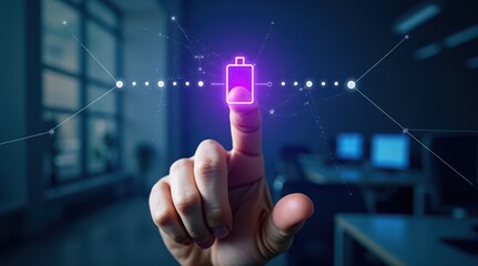 A person's finger interacts with a glowing digital battery icon, symbolizing advanced technology and energy solutions in a modern workspace.