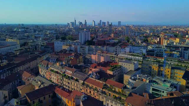 Aerial view of modern cityscape of business skyscrapers. Palazzo Lombardy region, unicredit and UnipolSai tower, vertical forest. trees in the park. roofs of buildings. Horizon. Milan Italy 25.10.2025