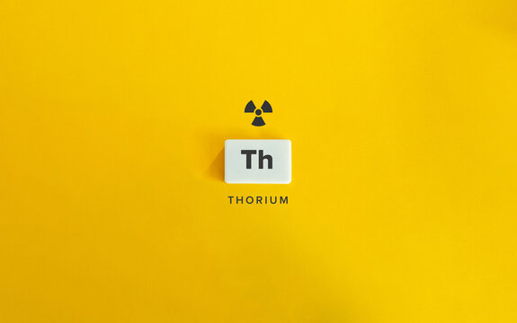 Thorium Banner image. Radioactive Chemical Element. Radioactivity Symbol and Text on Block Letter Tile on Yellow Background. 
