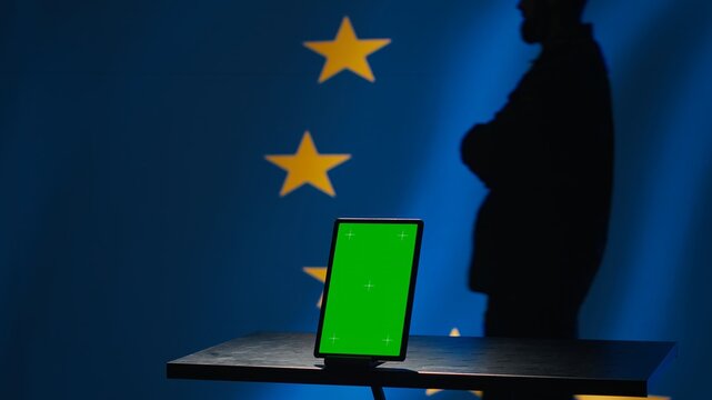 European Union counterintelligence division uses green screen tablet to protect against propaganda affecting elections. EU security service safeguarding democracy online using mockup device, camera A
