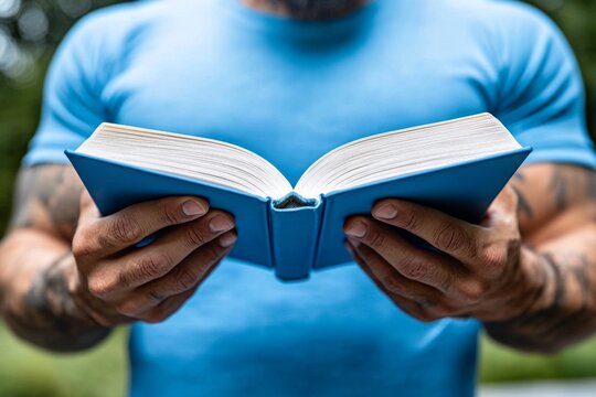 A person smiling while reading a good book, capturing the simple pleasures that make life enjoyable