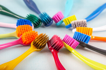 Colorful toothbrushes close-up. Stock footage of different multi-colored toothbrushes. Toothbrush on a white background.